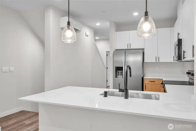 a kitchen with a stove and a sink