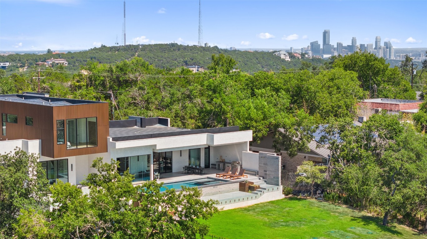 1409 The High Road Austin, TX 78746 - Photo 1 of 1 a view of a patio with table and chairs and potted plants