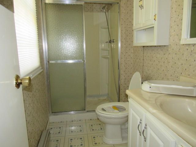 300 Stone Church Road Grindstone, PA 15442 - Photo 13 of 18 a bathroom with a toilet and a shower