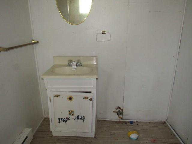 300 Stone Church Road Grindstone, PA 15442 - Photo 15 of 18 a bathroom with a granite countertop sink and a mirror