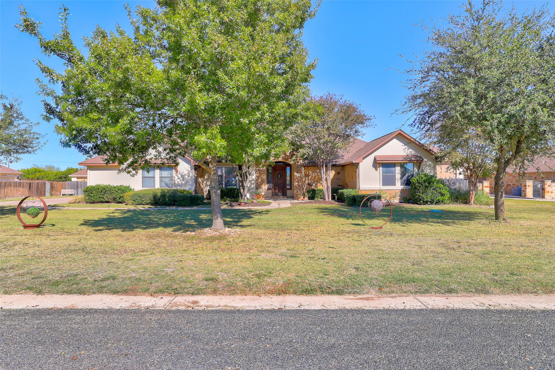 Undisclosed Address Georgetown, TX 78633 - Photo 5 of 39 a front view of a house with a yard