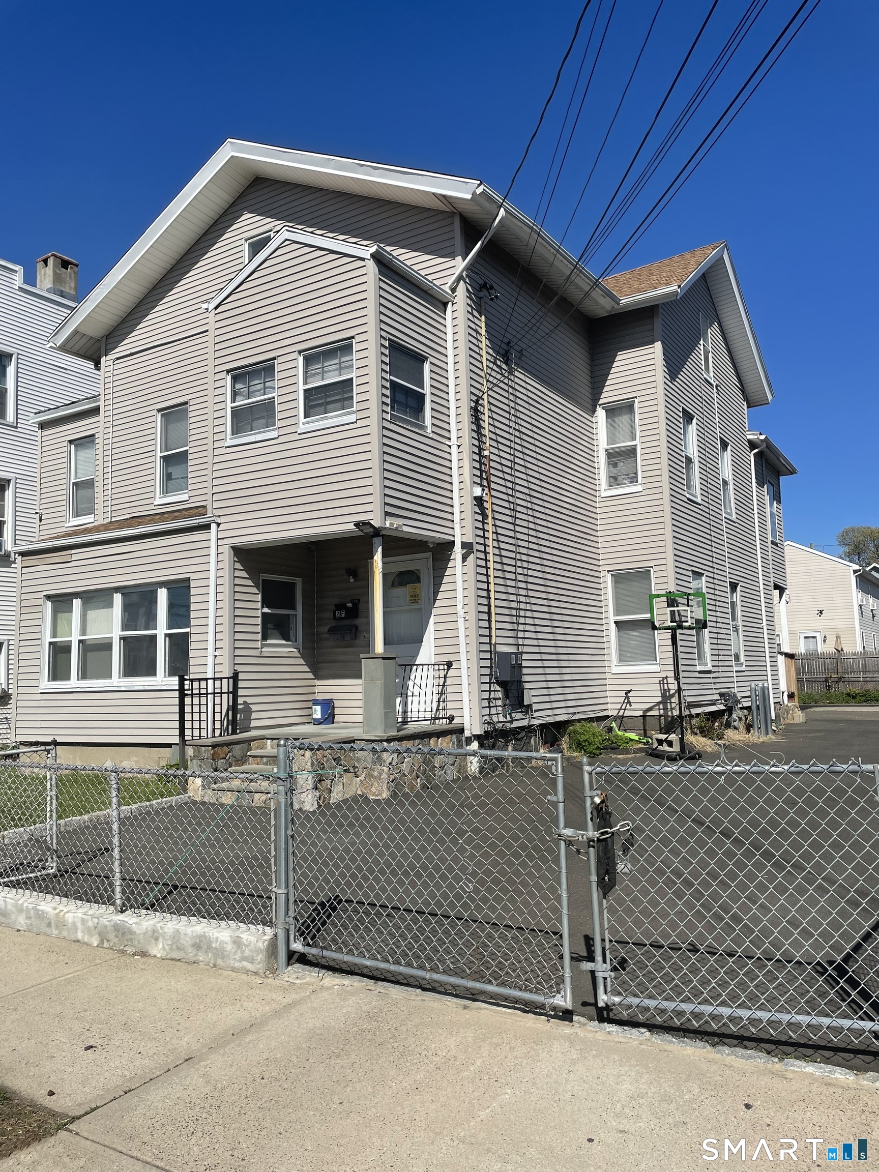 196 Park Street Bridgeport, CT 06608 - Photo 1 of 6 a front view of a house with garage