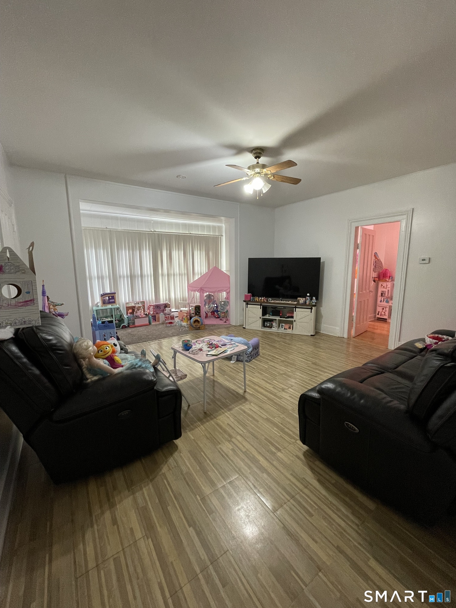 196 Park Street Bridgeport, CT 06608 - Photo 3 of 6 a living room with furniture and a flat screen tv