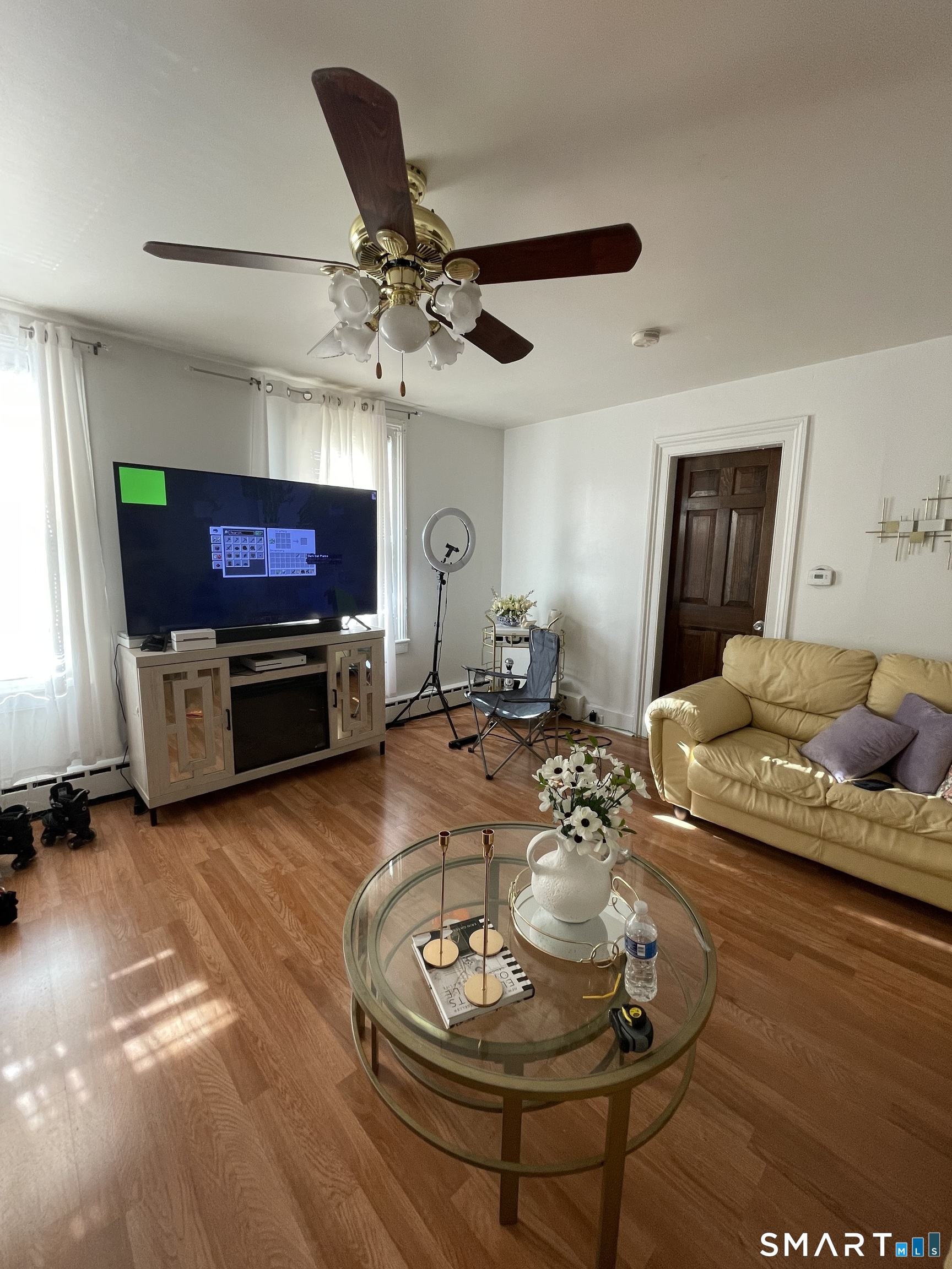 196 Park Street Bridgeport, CT 06608 - Photo 5 of 6 a living room with furniture and a flat screen tv