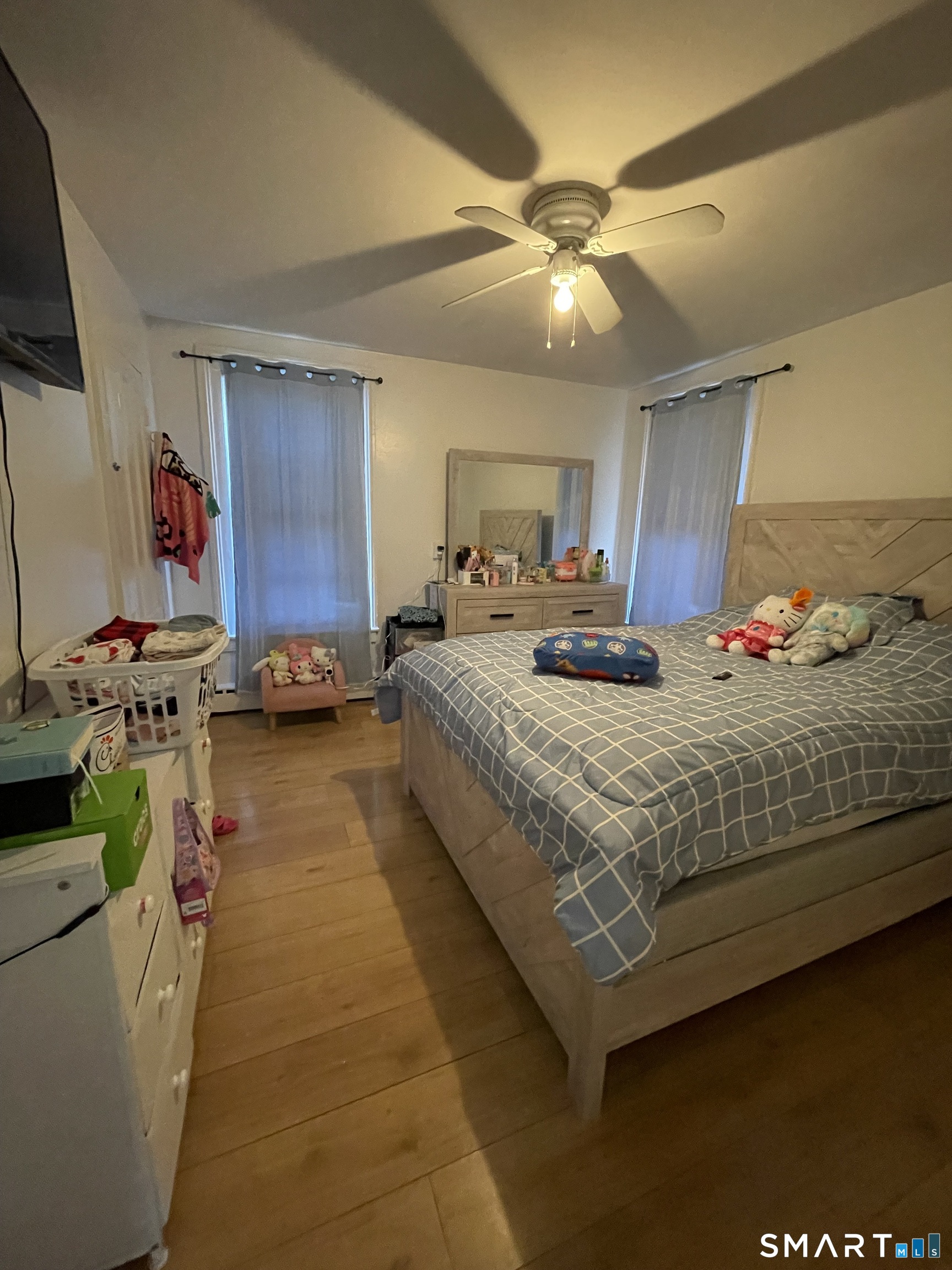 196 Park Street Bridgeport, CT 06608 - Photo 6 of 6 a bedroom with bed and a chandelier