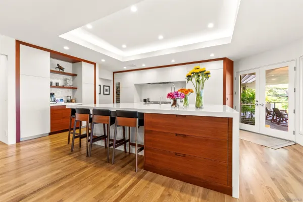 a living room with furniture and painting on the wall
