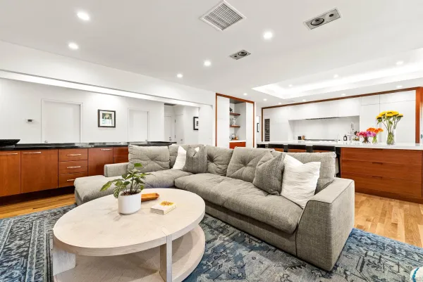 a spacious bedroom with a bed and a large window