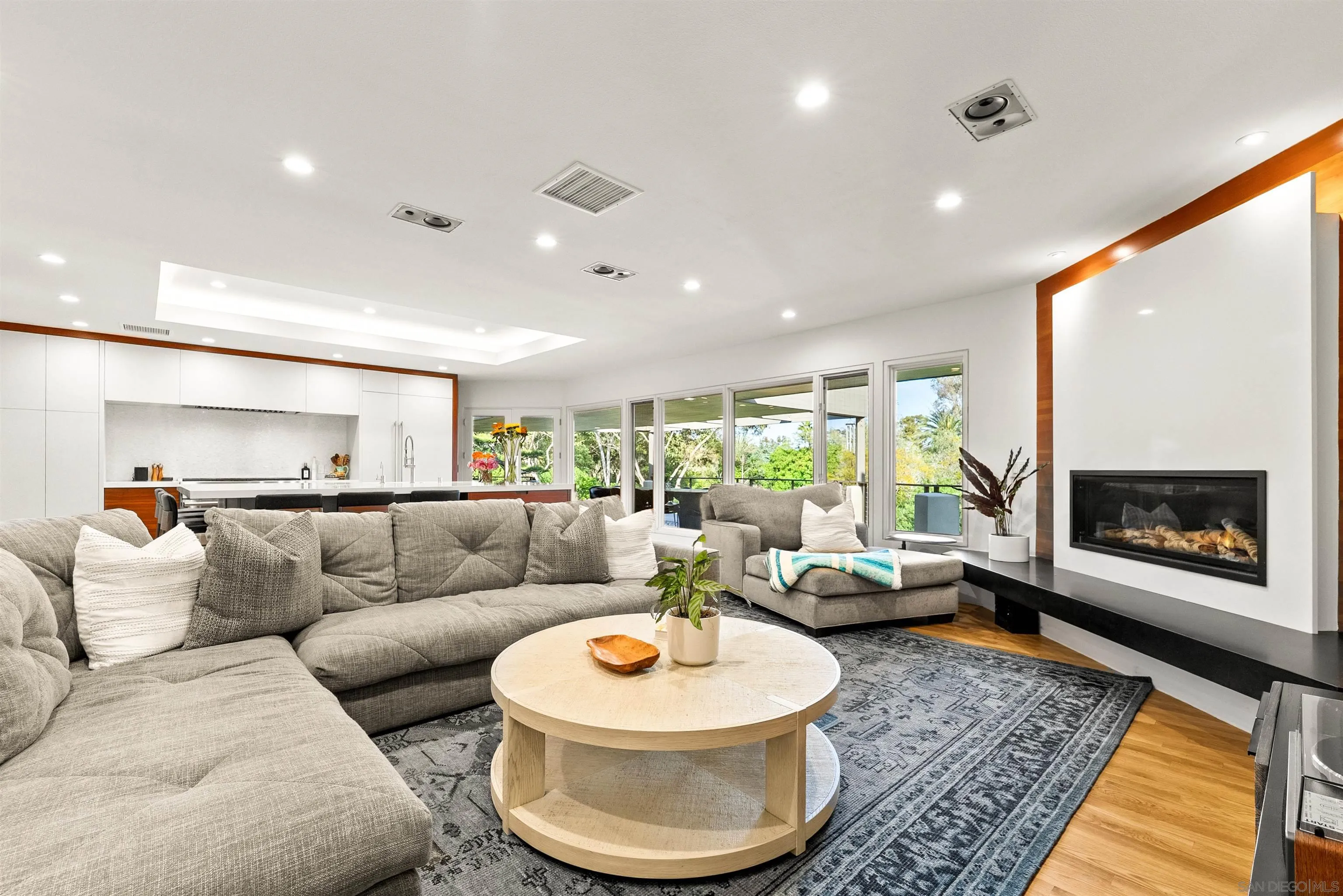5491 Calzada Del Bosque Rancho Santa Fe, CA 92067 - Photo 17 of 69 a living room with furniture and a fireplace