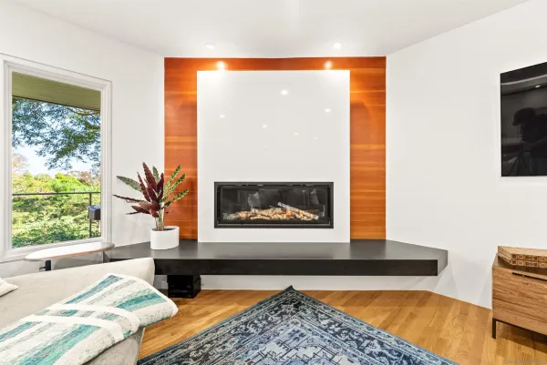 a spacious bedroom with a bed and a large window