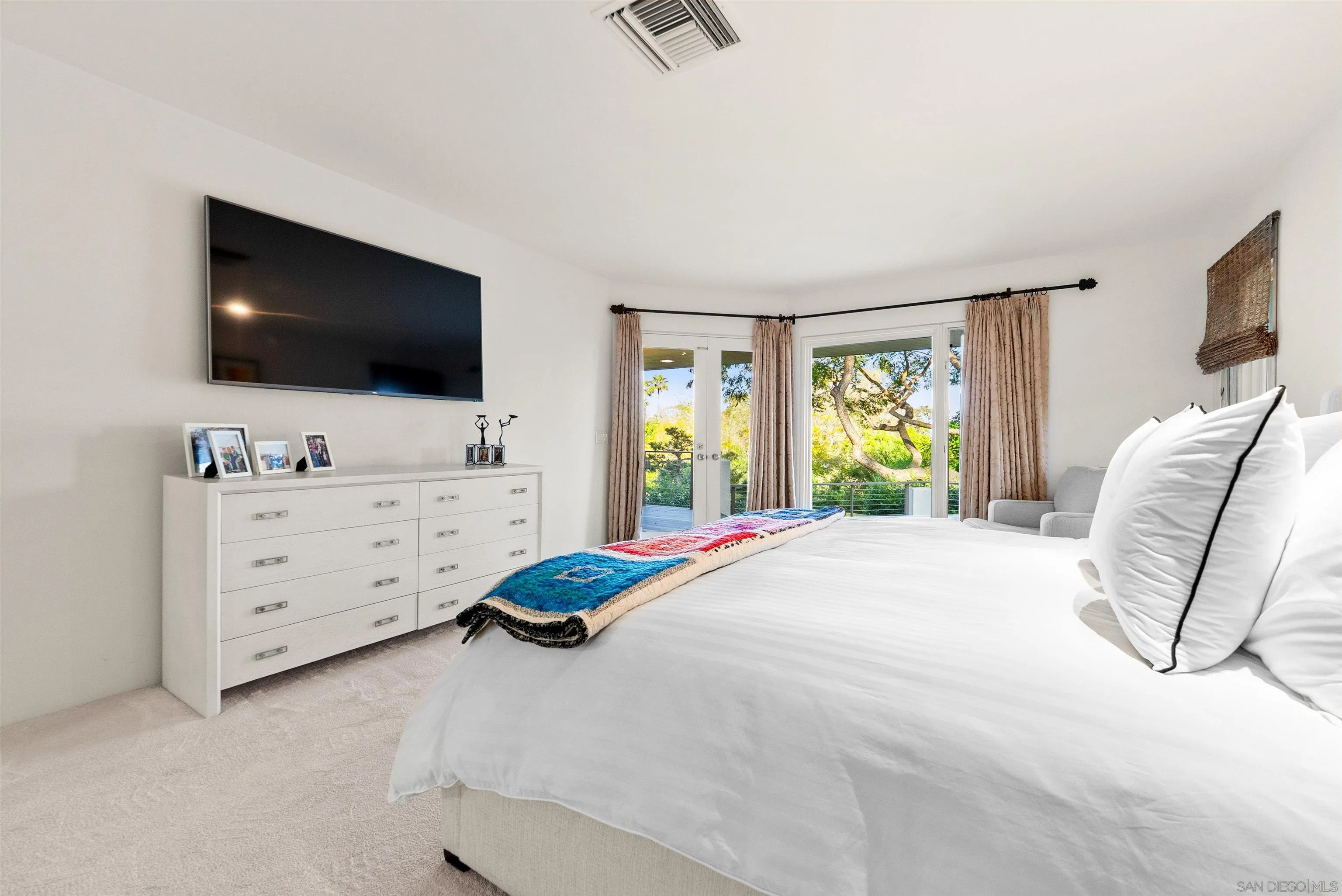 5491 Calzada Del Bosque Rancho Santa Fe, CA 92067 - Photo 20 of 69 a bedroom with a bed and a flat screen tv