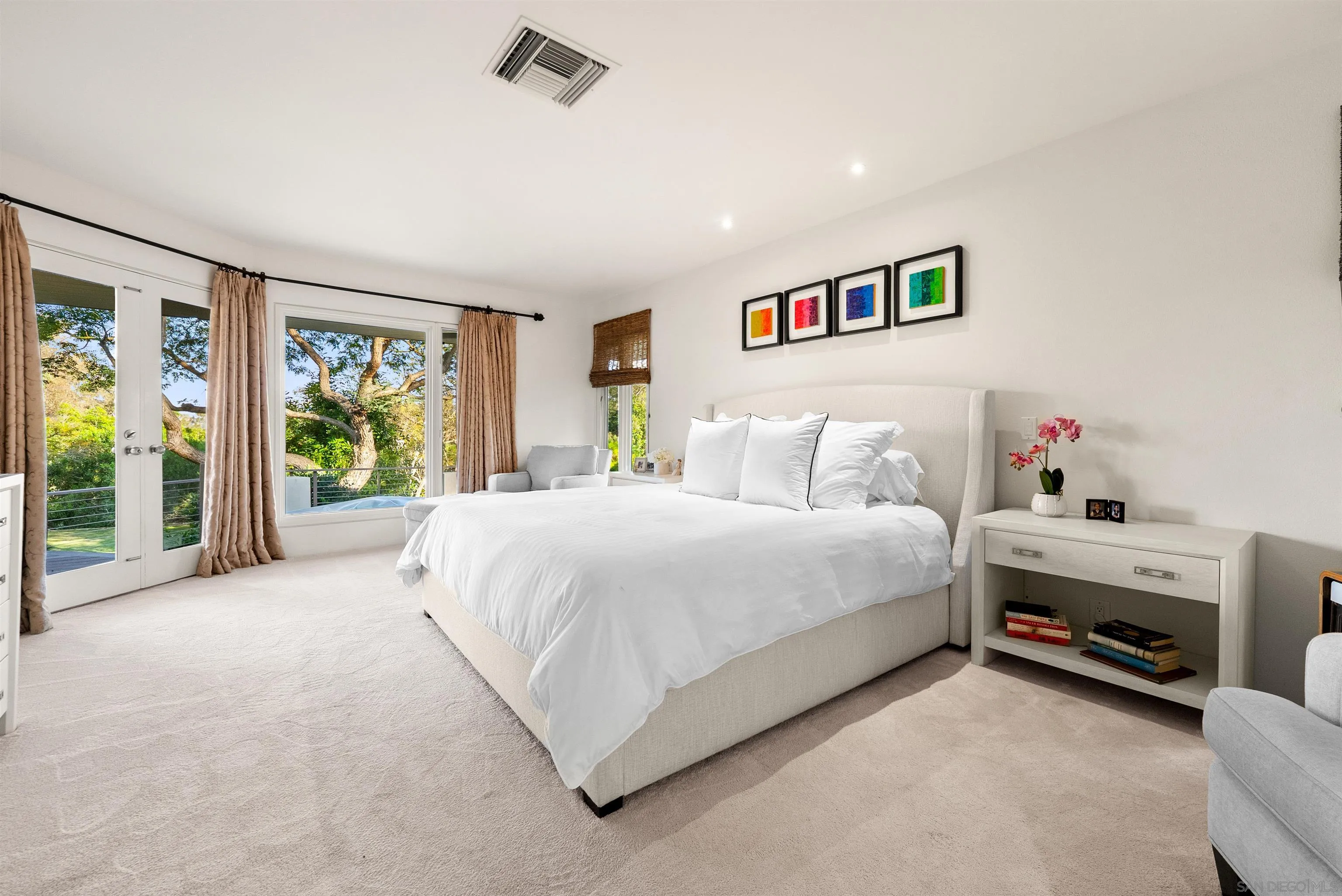 5491 Calzada Del Bosque Rancho Santa Fe, CA 92067 - Photo 21 of 69 a spacious bedroom with a bed and a large window