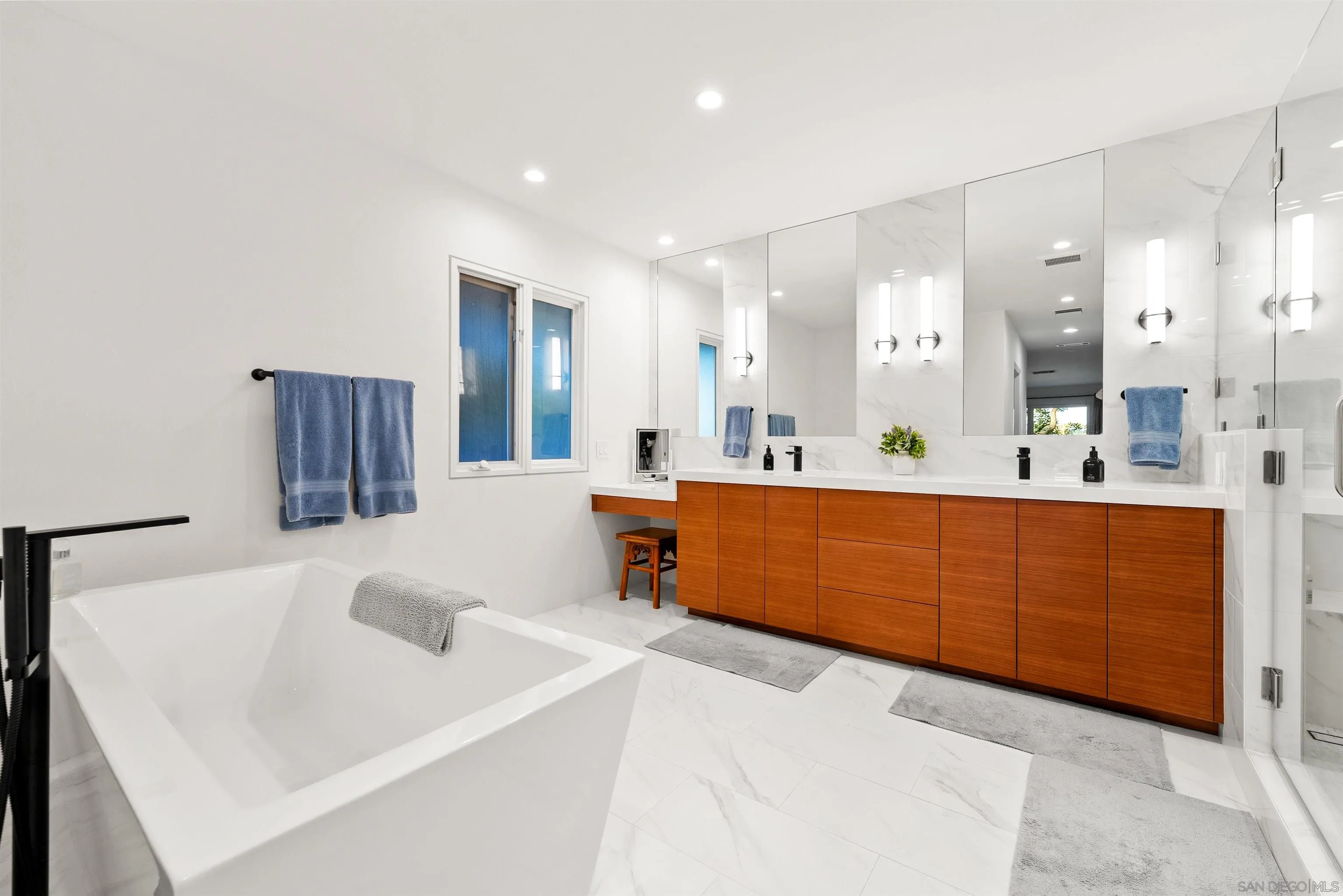 5491 Calzada Del Bosque Rancho Santa Fe, CA 92067 - Photo 26 of 69 a large bathroom with a double vanity sink mirror and shower