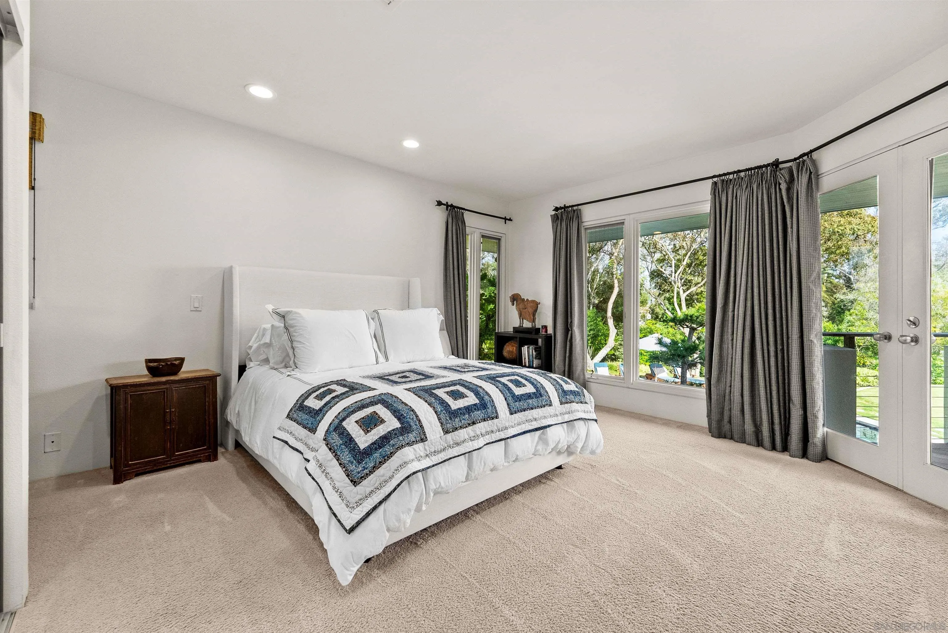 5491 Calzada Del Bosque Rancho Santa Fe, CA 92067 - Photo 28 of 69 a spacious bedroom with a bed and a large window