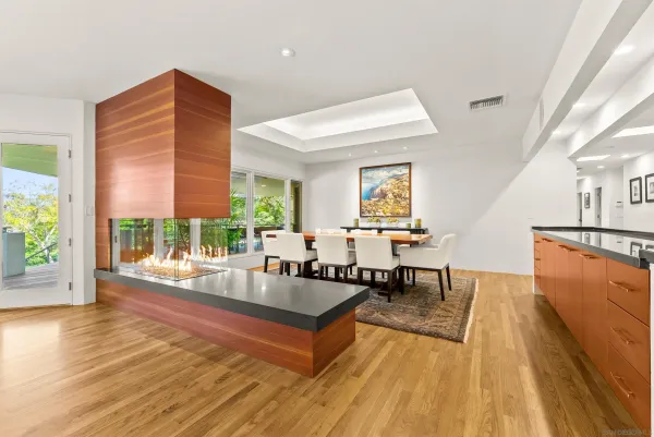 a view of a dining room with furniture wooden floor and a rug