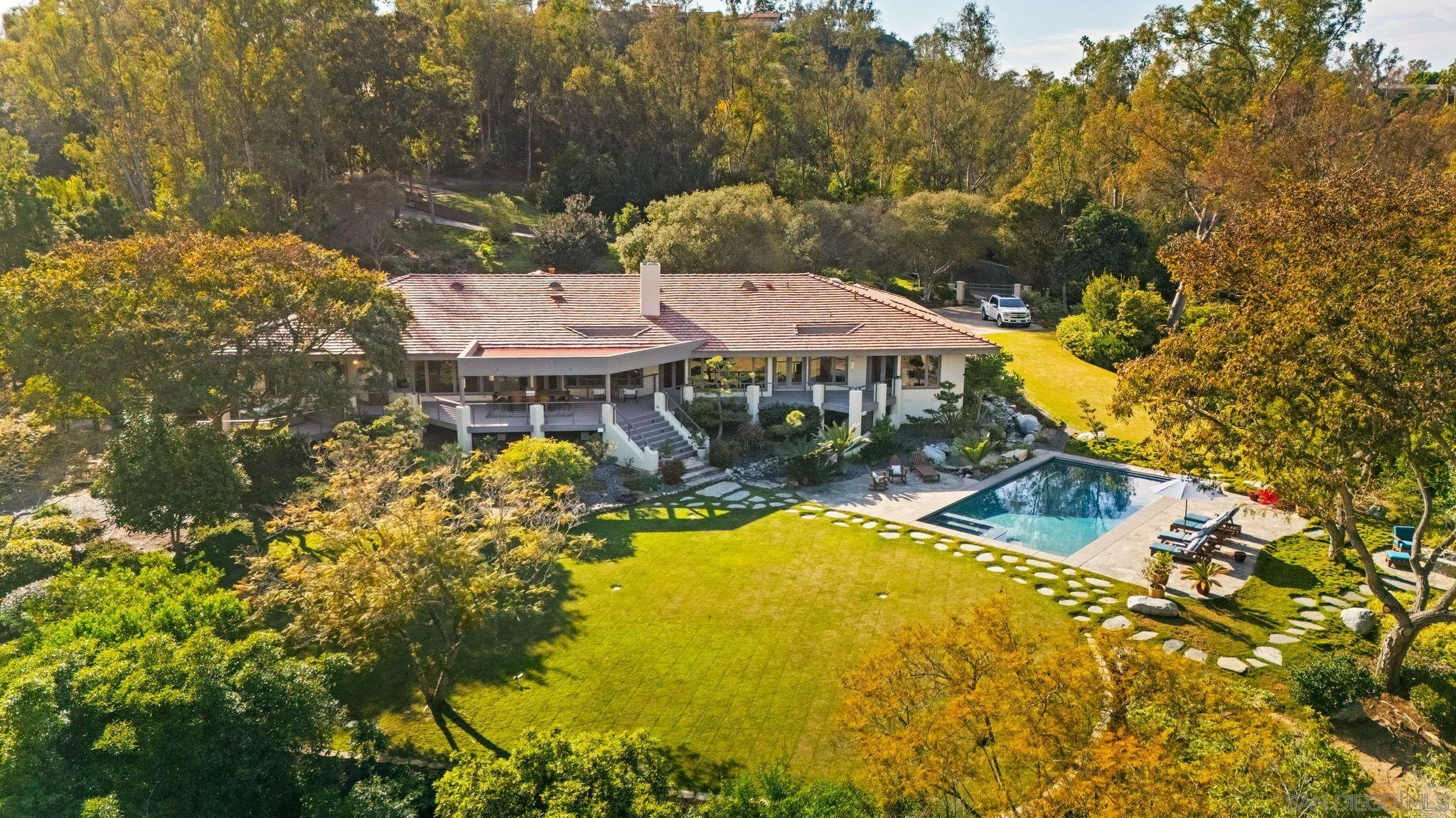 5491 Calzada Del Bosque Rancho Santa Fe, CA 92067 - Photo 39 of 69 an aerial view of a house with swimming pool and large trees