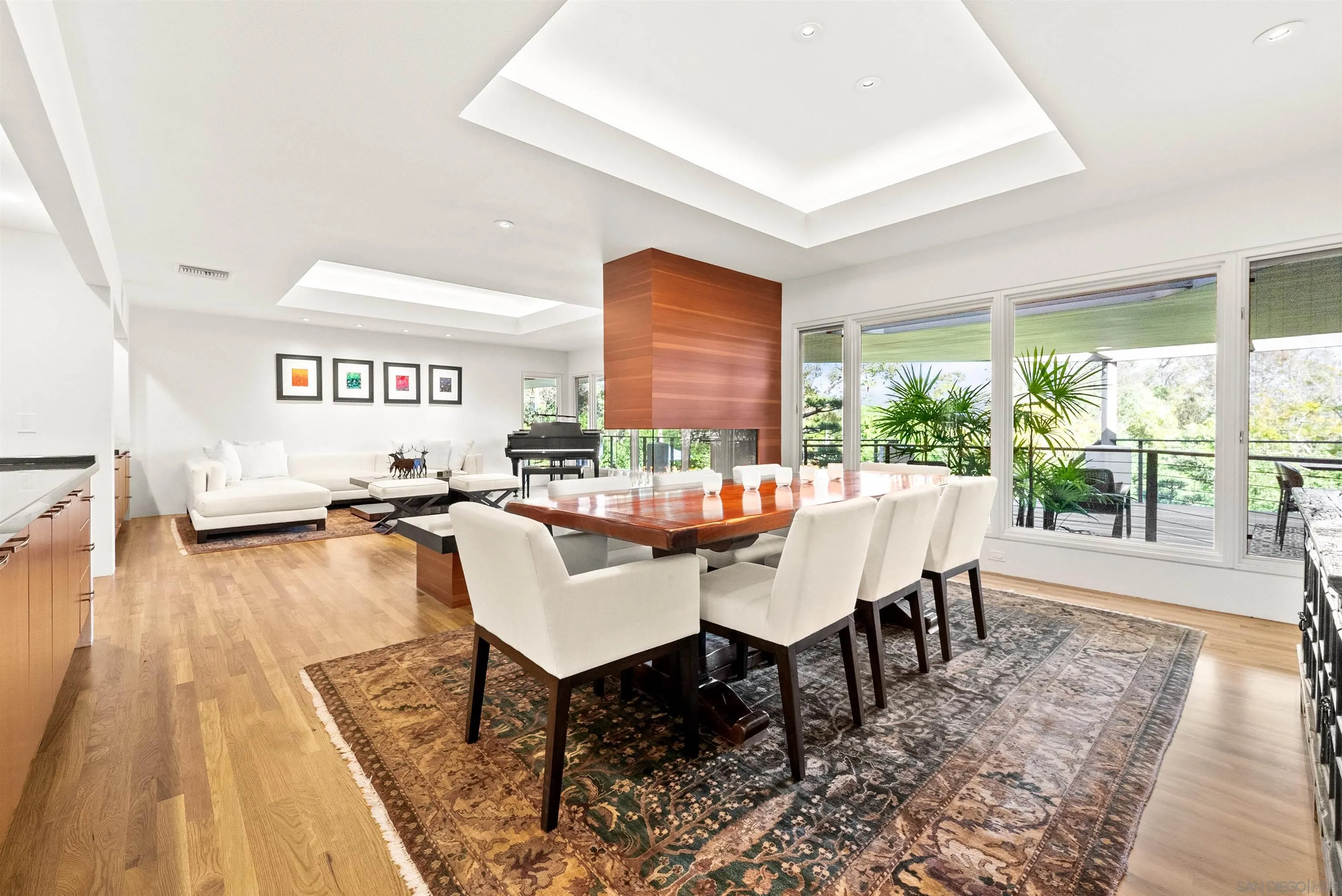 5491 Calzada Del Bosque Rancho Santa Fe, CA 92067 - Photo 4 of 69 a view of a dining room with furniture wooden floor and a rug