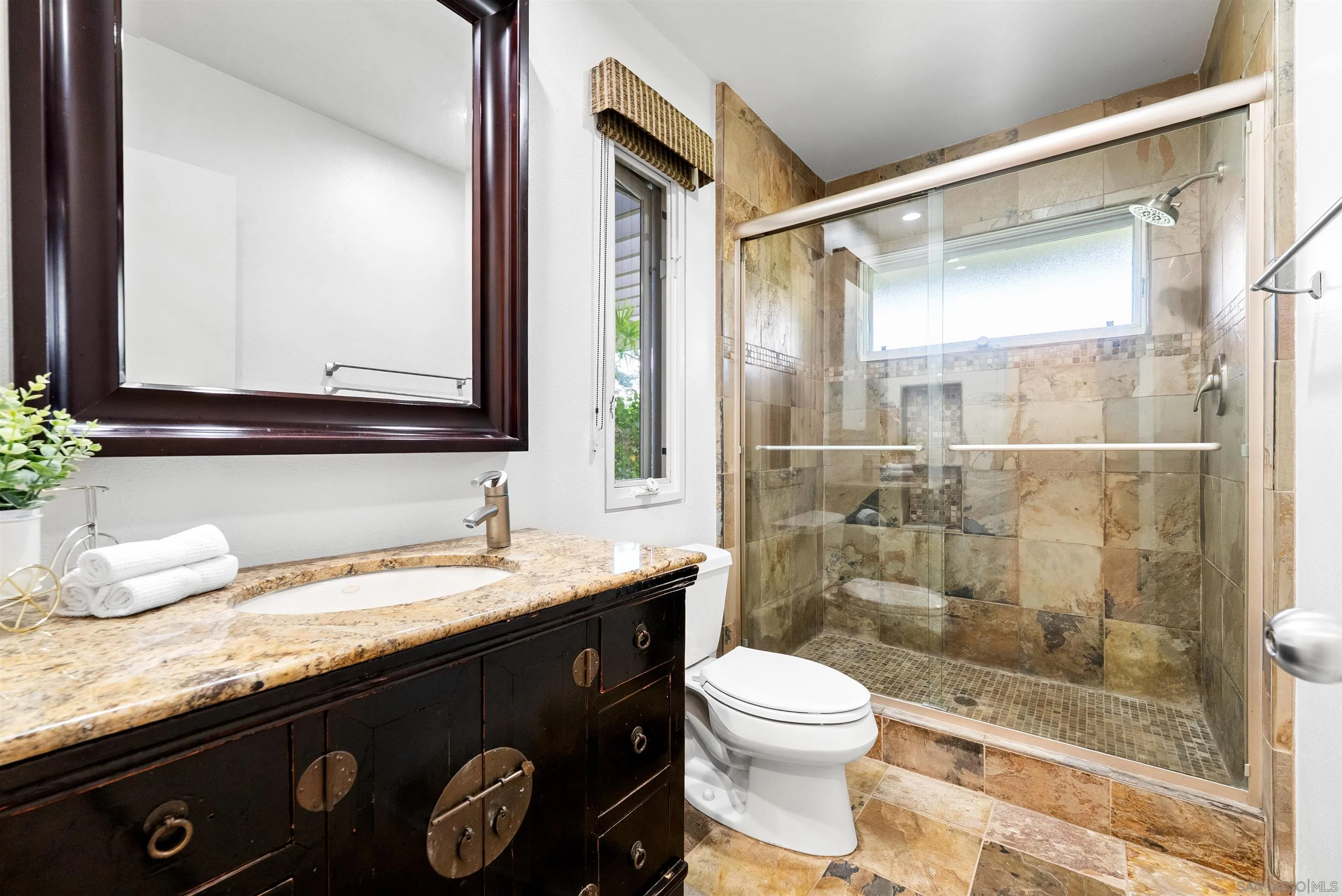 5491 Calzada Del Bosque Rancho Santa Fe, CA 92067 - Photo 48 of 69 a bathroom with a granite countertop sink mirror vanity and toilet