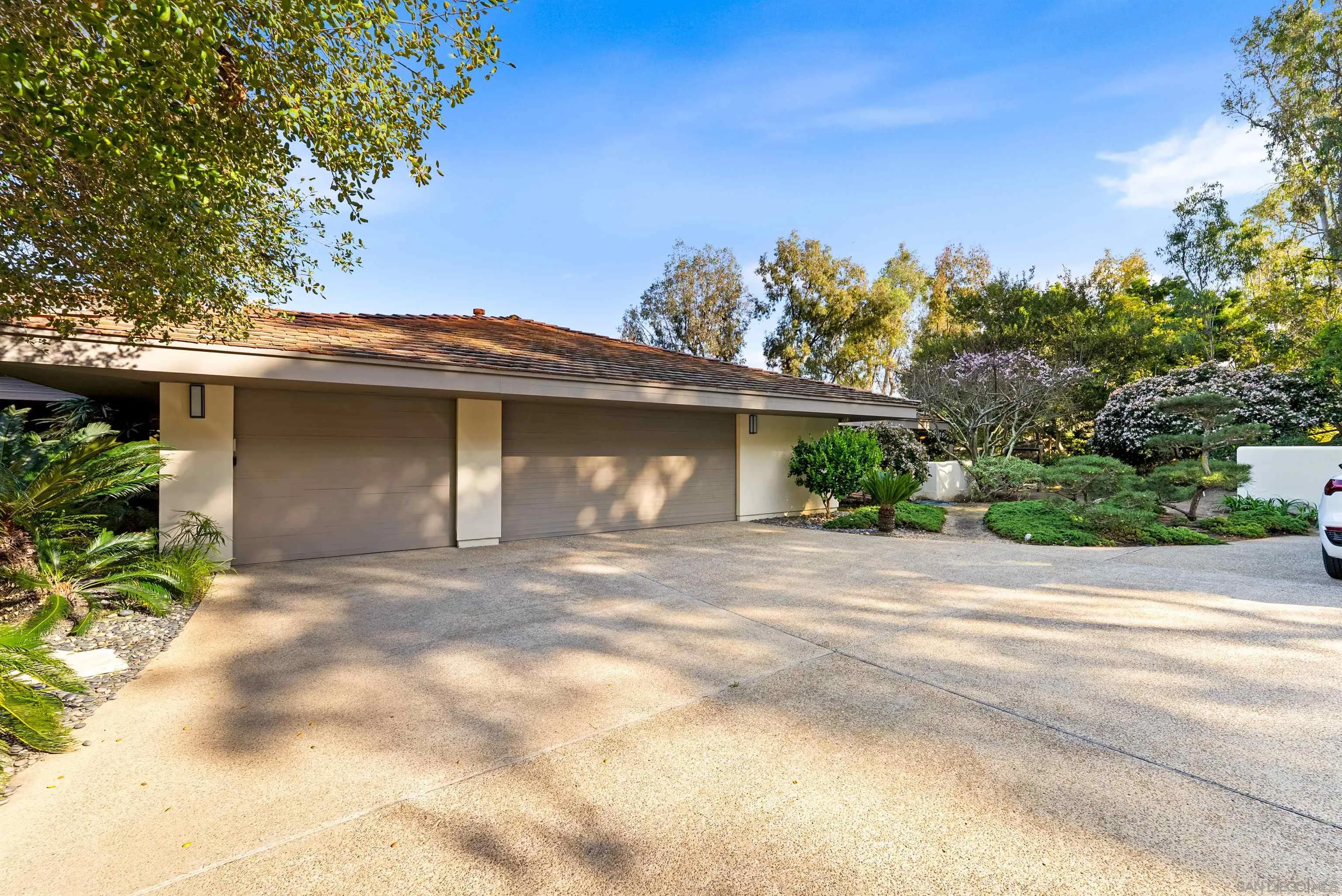 5491 Calzada Del Bosque Rancho Santa Fe, CA 92067 - Photo 49 of 69 a front view of a house with a yard