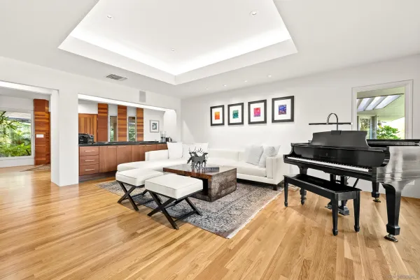 a dining room with furniture wooden floor and a rug