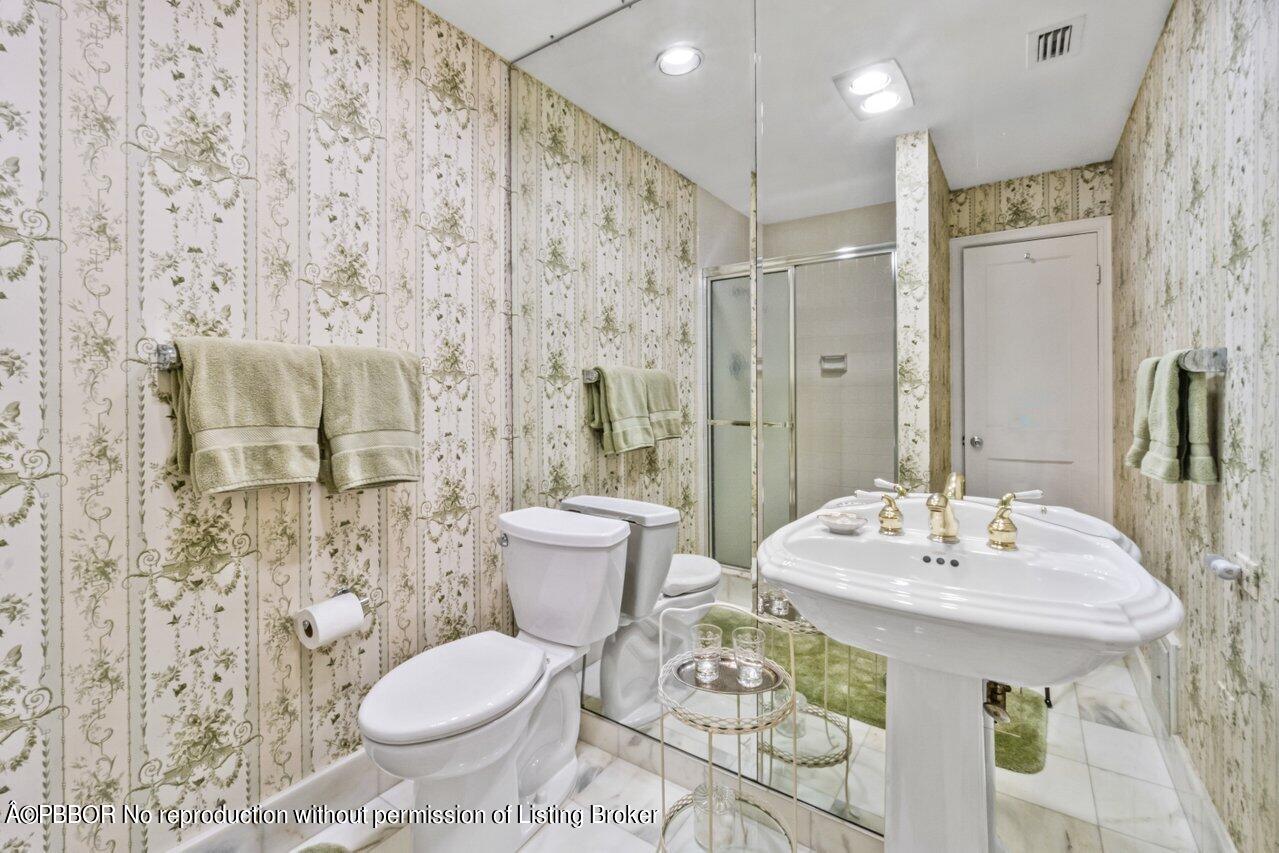 355 Cocoanut Row, Unit 2 Palm Beach, FL 33480 - Photo 14 of 26 a bathroom with a sink toilet and shower