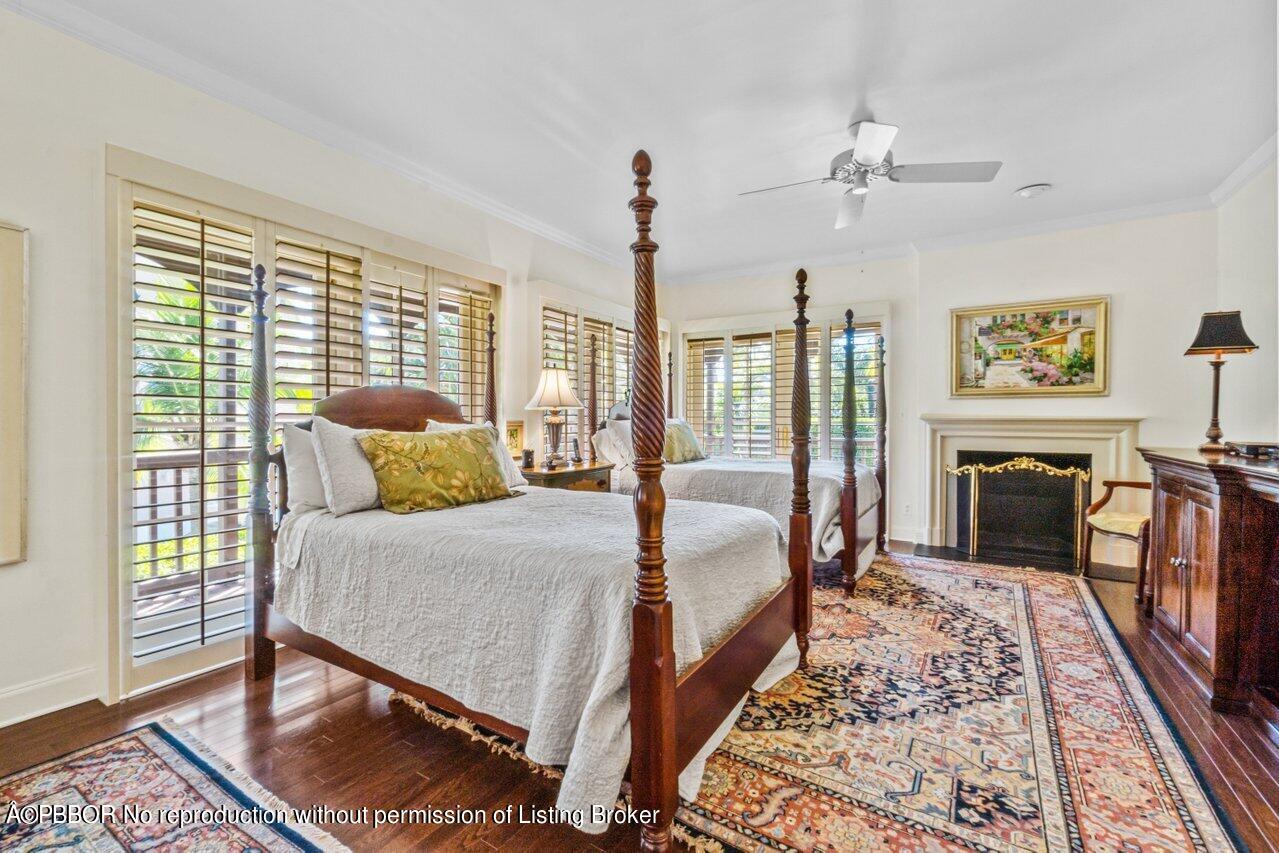 355 Cocoanut Row, Unit 2 Palm Beach, FL 33480 - Photo 15 of 26 a bedroom with furniture and a fireplace