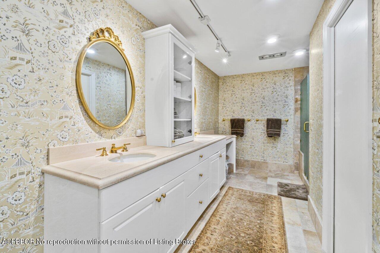 355 Cocoanut Row, Unit 2 Palm Beach, FL 33480 - Photo 18 of 26 a bathroom with a sink and a mirror
