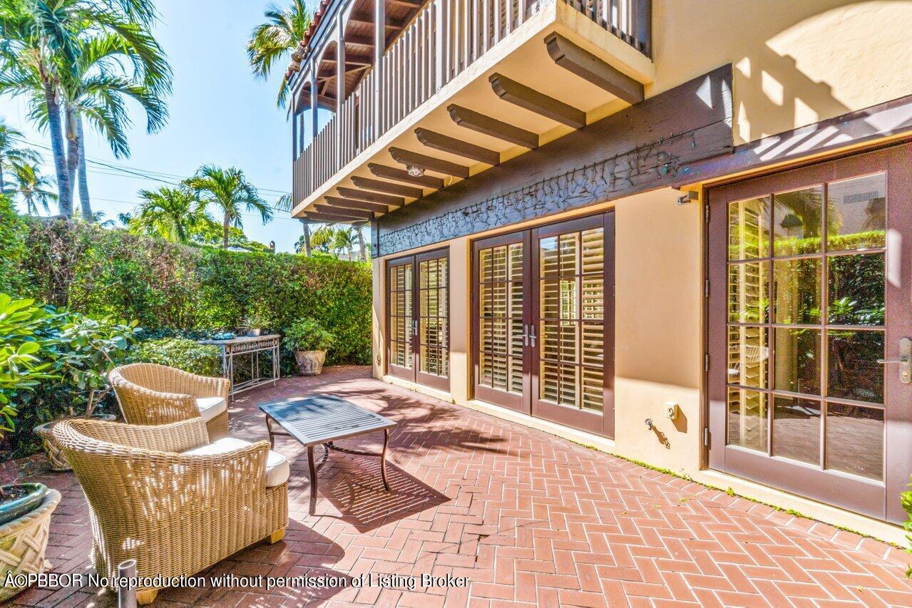 355 Cocoanut Row, Unit 2 Palm Beach, FL 33480 - Photo 20 of 26 a patio area with patio furniture