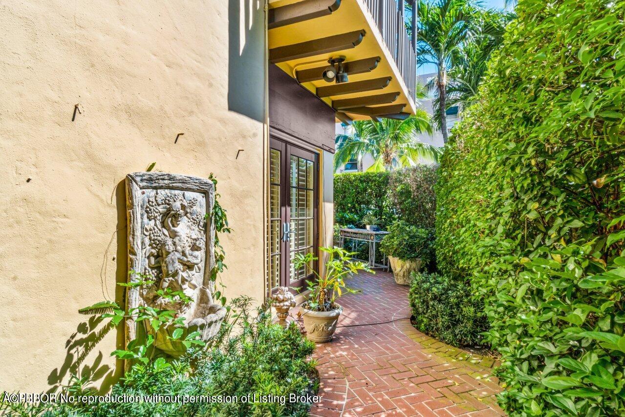 355 Cocoanut Row, Unit 2 Palm Beach, FL 33480 - Photo 22 of 26 front view of a house with a yard