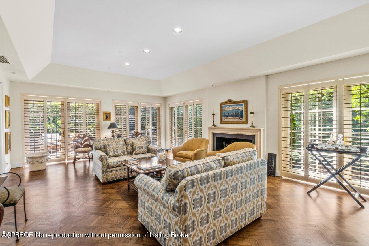 355 Cocoanut Row, Unit 2 Palm Beach, FL 33480 - Photo 5 of 26 a living room with furniture and a large window with balcony view