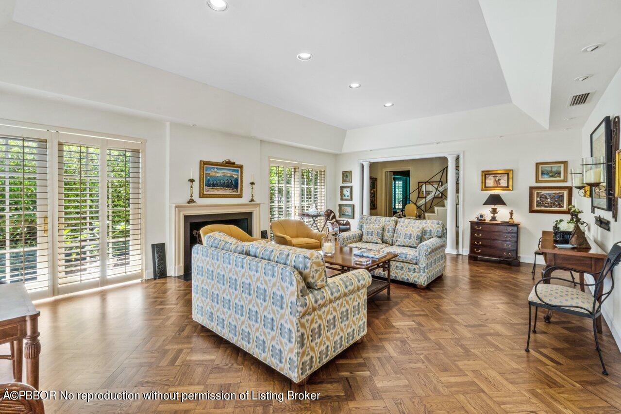355 Cocoanut Row, Unit 2 Palm Beach, FL 33480 - Photo 6 of 26 a living room with furniture large window and a fireplace