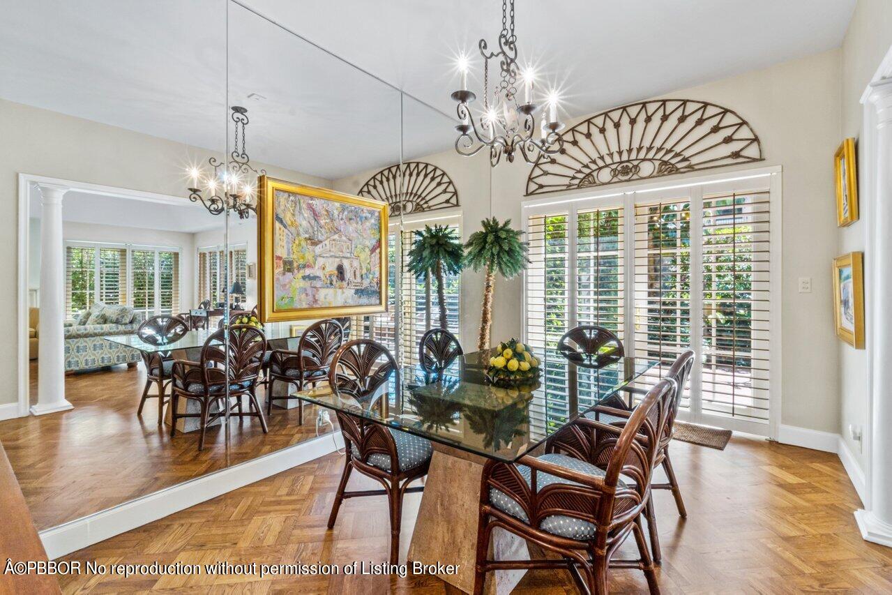 355 Cocoanut Row, Unit 2 Palm Beach, FL 33480 - Photo 8 of 26 a view of a dining room with furniture window and wooden floor
