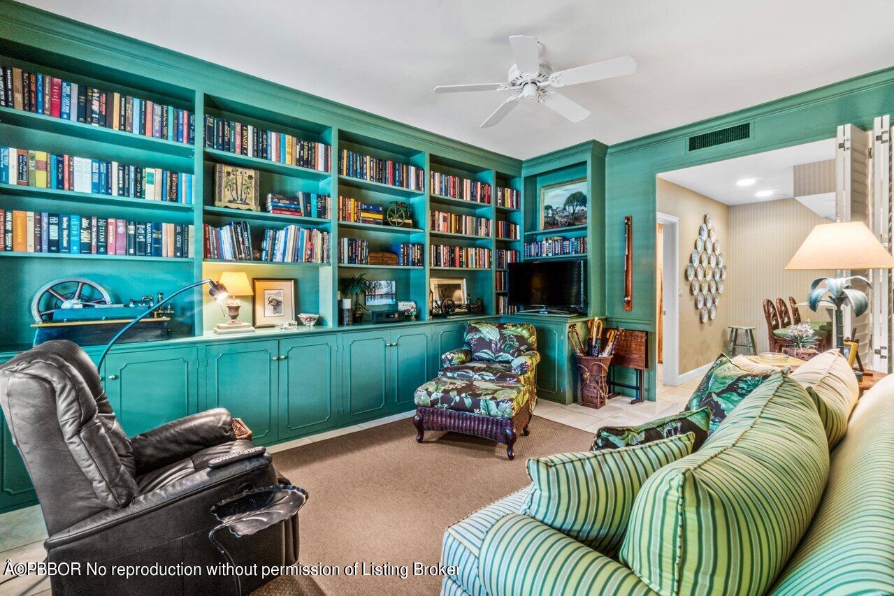 355 Cocoanut Row, Unit 2 Palm Beach, FL 33480 - Photo 10 of 26 a living room with furniture a bookshelf and a book shelf