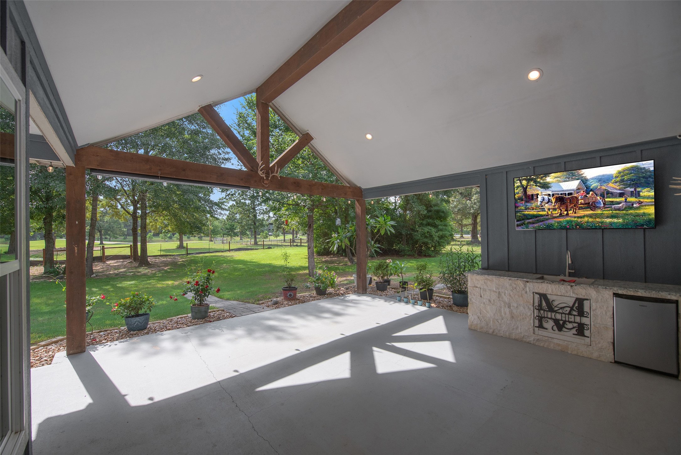 28406 Riley Road Waller, TX 77484 - Photo 25 of 31 The covered porch is perfect for morning coffee, evening sunsets, and pretending you're going to mow later that afternoon.