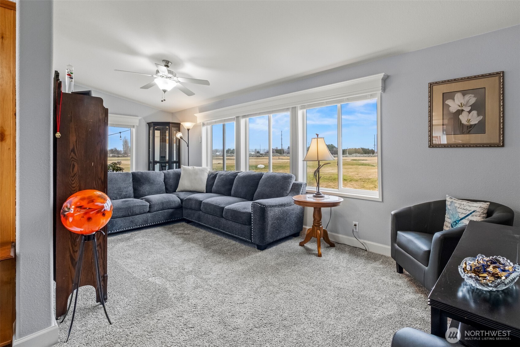 17693 Road 5 Northwest, Unit 52 Quincy, WA 98848 - Photo 12 of 25 a living room with furniture a rug and a window