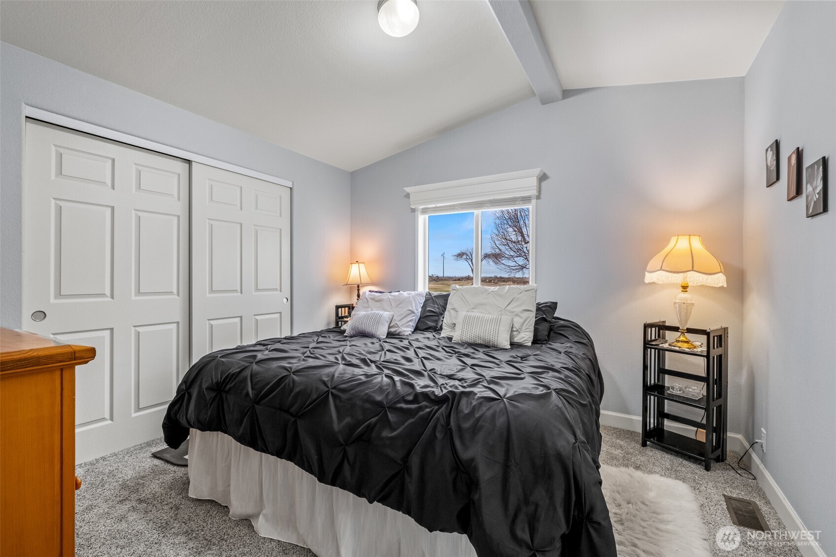 17693 Road 5 Northwest, Unit 52 Quincy, WA 98848 - Photo 15 of 25 a bedroom with a bed and a lamp