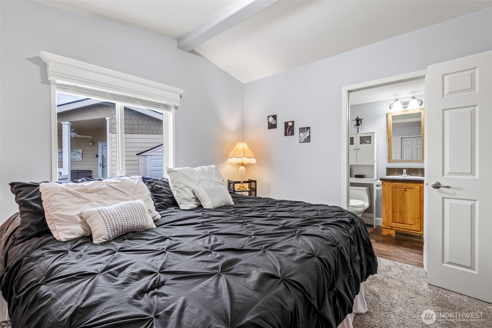 17693 Road 5 Northwest, Unit 52 Quincy, WA 98848 - Photo 16 of 25 a bedroom with a bed and a view of living room