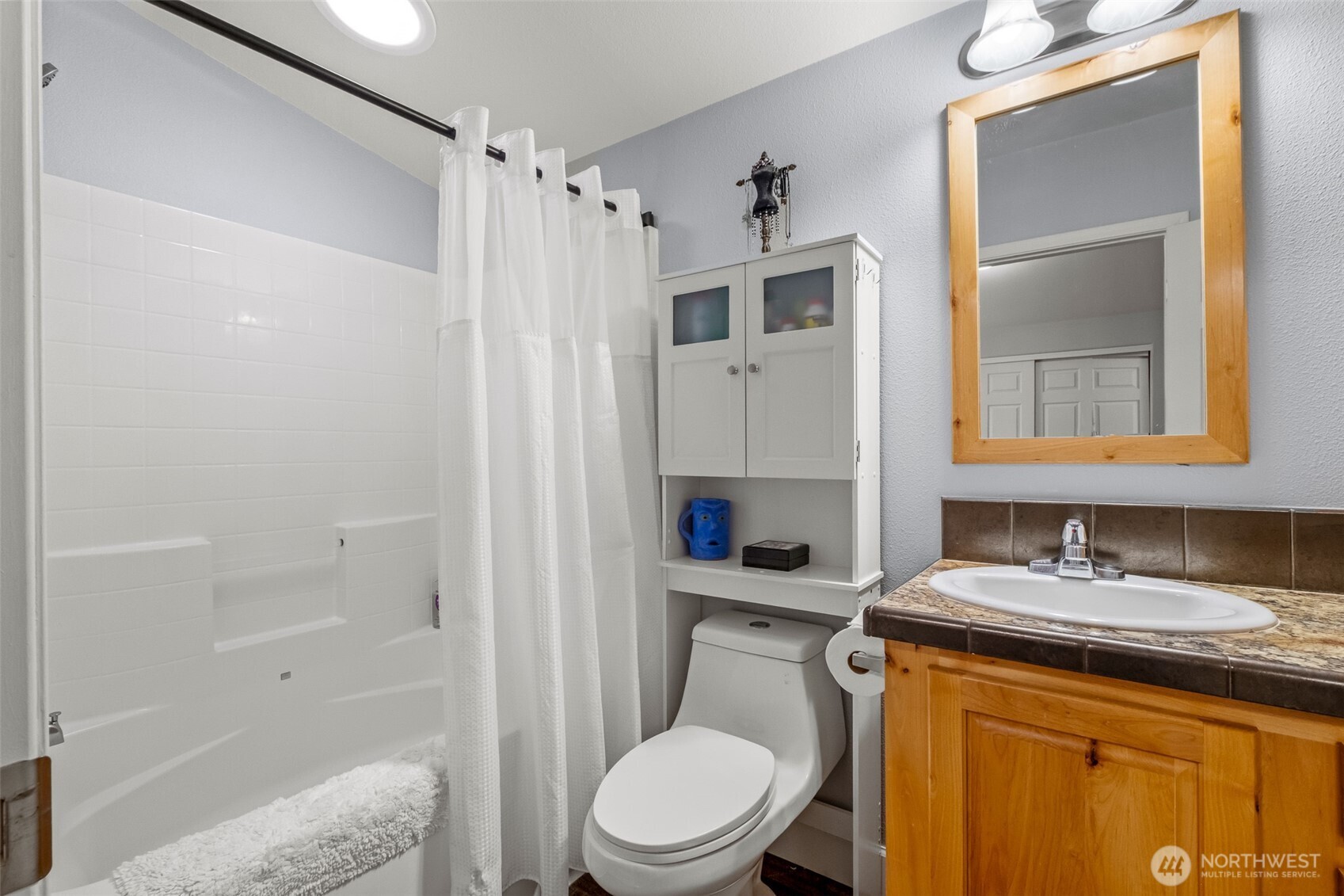 17693 Road 5 Northwest, Unit 52 Quincy, WA 98848 - Photo 17 of 25 a bathroom with a granite countertop sink toilet and shower
