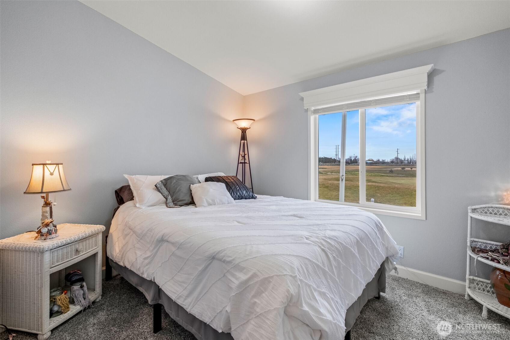 17693 Road 5 Northwest, Unit 52 Quincy, WA 98848 - Photo 18 of 25 a bedroom with a bed and a window