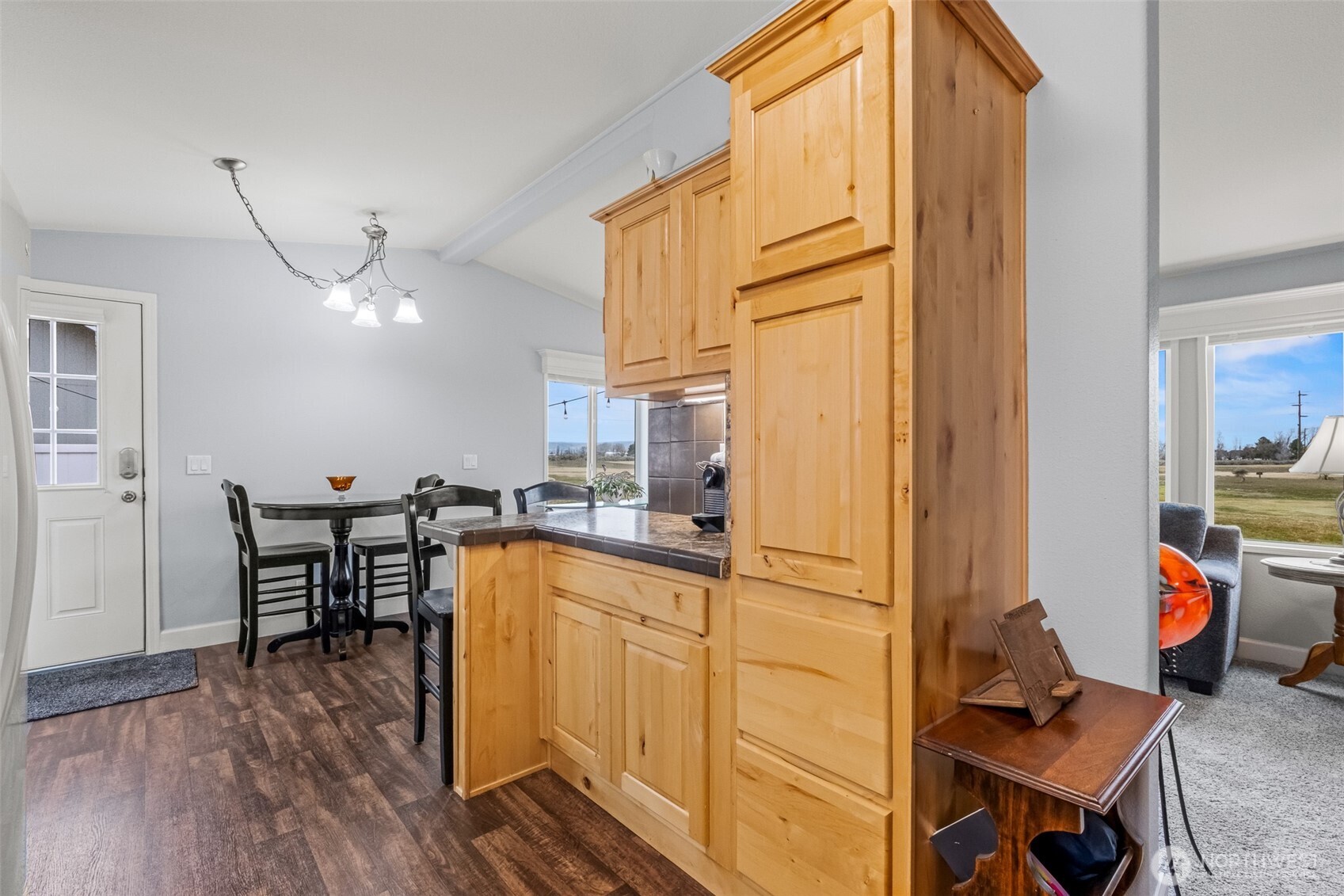 17693 Road 5 Northwest, Unit 52 Quincy, WA 98848 - Photo 6 of 25 a kitchen with stainless steel appliances granite countertop a refrigerator and microwave