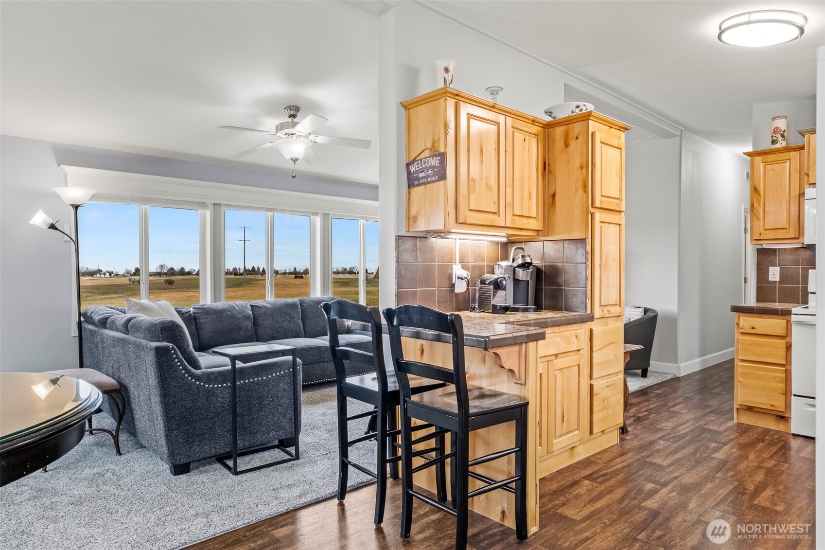 17693 Road 5 Northwest, Unit 52 Quincy, WA 98848 - Photo 7 of 25 a living room with furniture and a large window