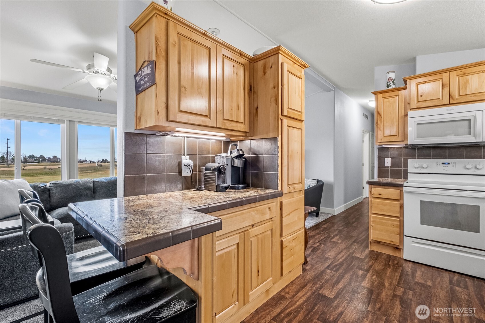 17693 Road 5 Northwest, Unit 52 Quincy, WA 98848 - Photo 8 of 25 a kitchen with stainless steel appliances kitchen island granite countertop a sink and cabinets