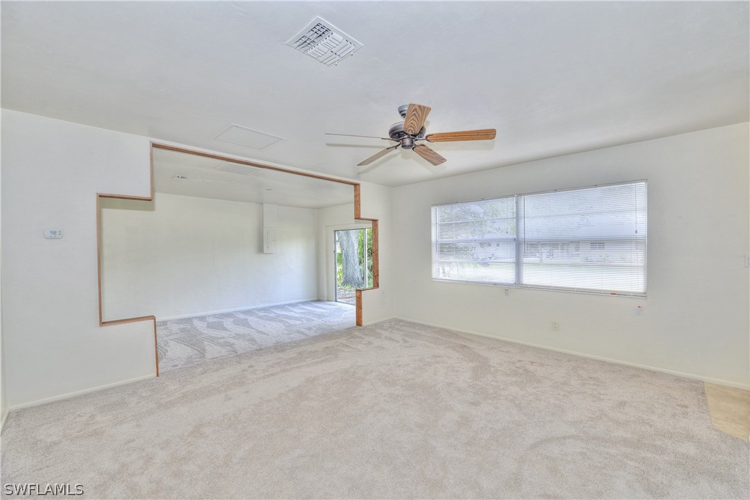 9321 Sedgefield Road North Fort Myers, FL 33917 - Photo 11 of 26 a view of an empty room with a window