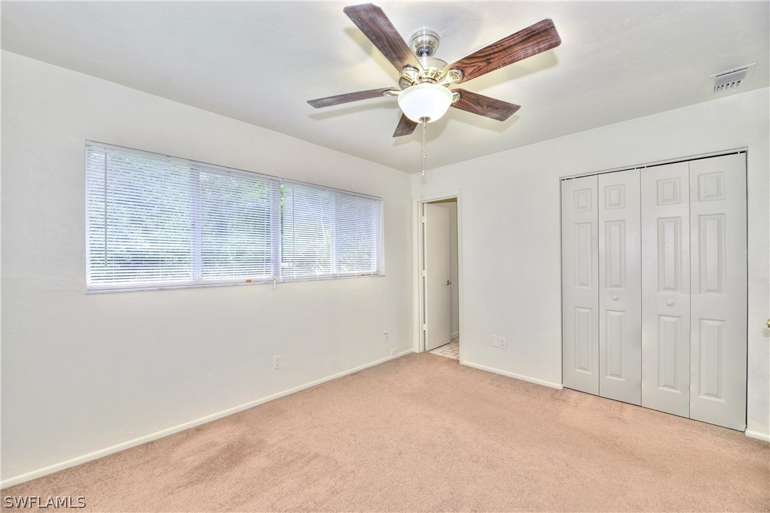 9321 Sedgefield Road North Fort Myers, FL 33917 - Photo 15 of 26 a view of an empty room with a window