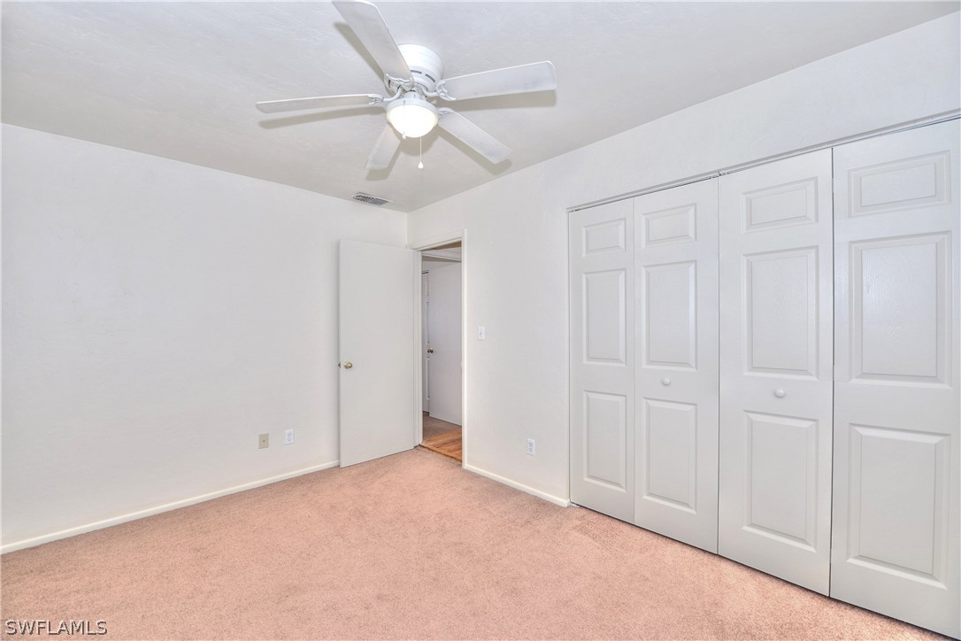 9321 Sedgefield Road North Fort Myers, FL 33917 - Photo 22 of 26 an empty room with fan