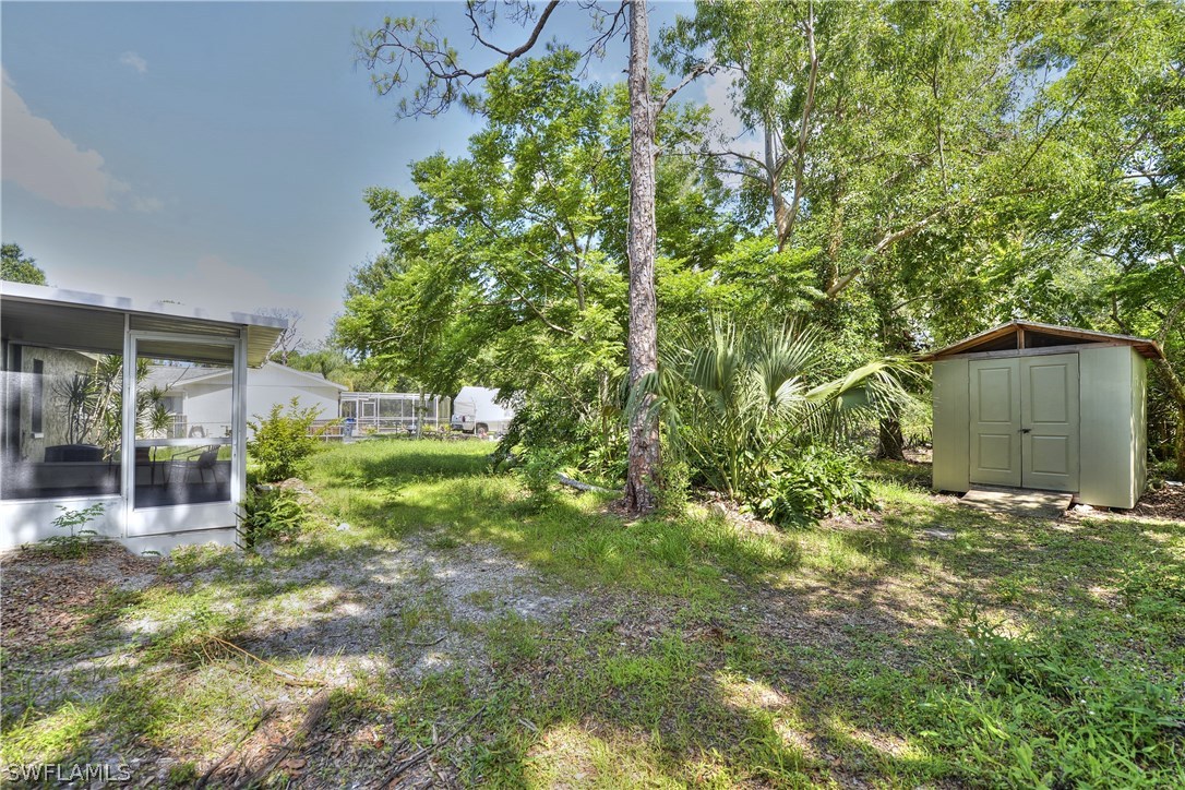 9321 Sedgefield Road North Fort Myers, FL 33917 - Photo 26 of 26 a backyard of a house with lots of green space