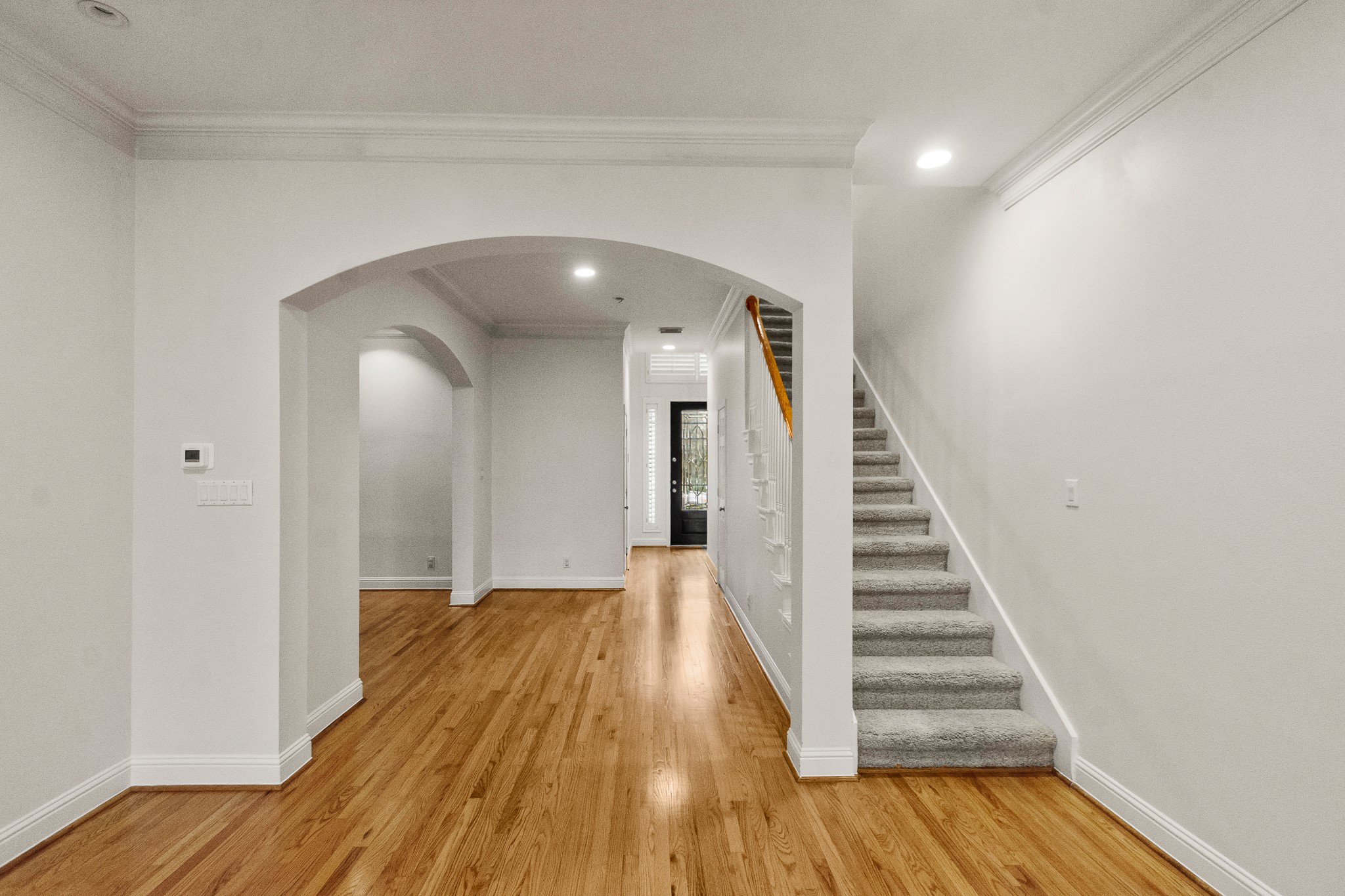 5351 McCulloch Circle Houston, TX 77056 - Photo 13 of 42 a view of a hallway with wooden floor and entryway