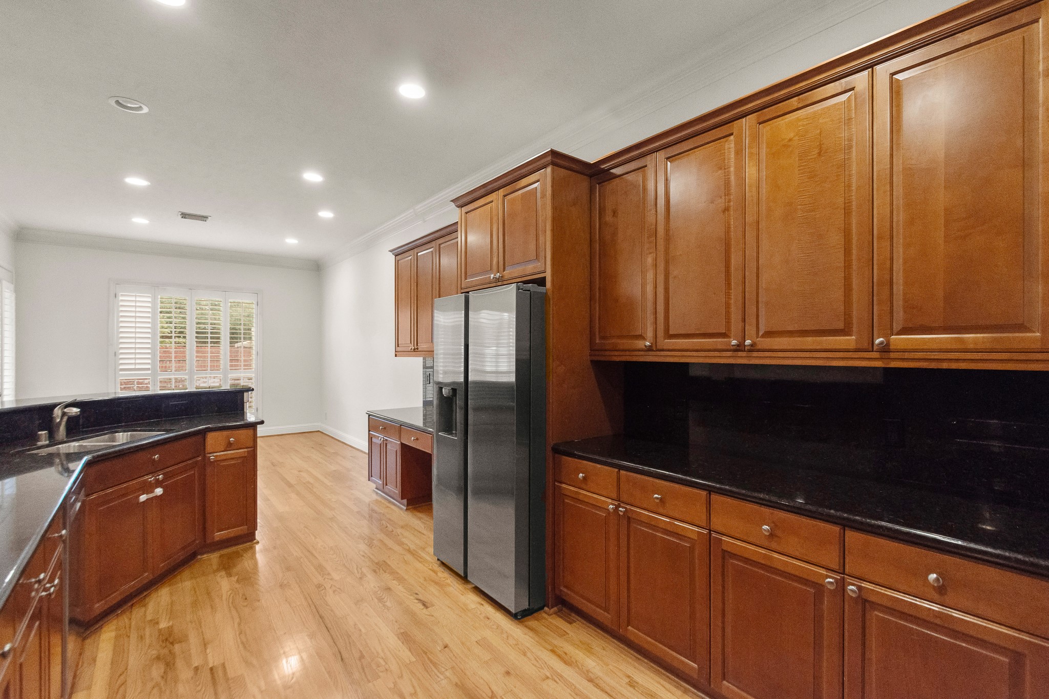 5351 McCulloch Circle Houston, TX 77056 - Photo 15 of 42 a kitchen with stainless steel appliances granite countertop a refrigerator and a sink