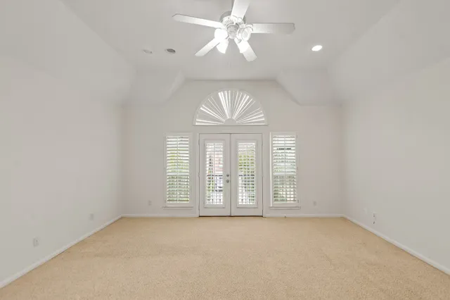 a bathroom with a tub a sink and mirror