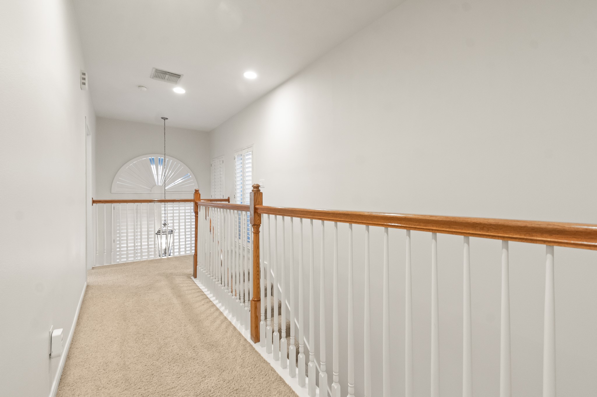5351 McCulloch Circle Houston, TX 77056 - Photo 30 of 42 a view of hallway with wooden floor