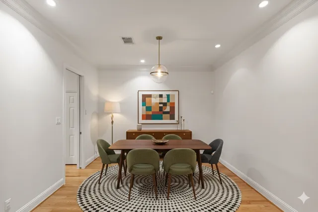a view of a room with wooden floor and staircase